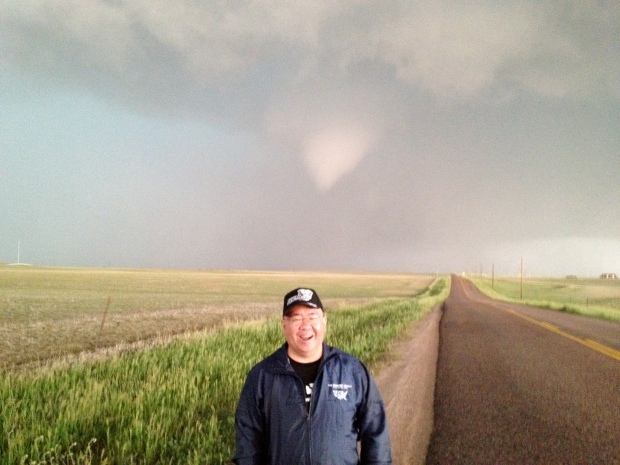 That's a funnel cloud lowering behind me in Colorado, summer 2012.